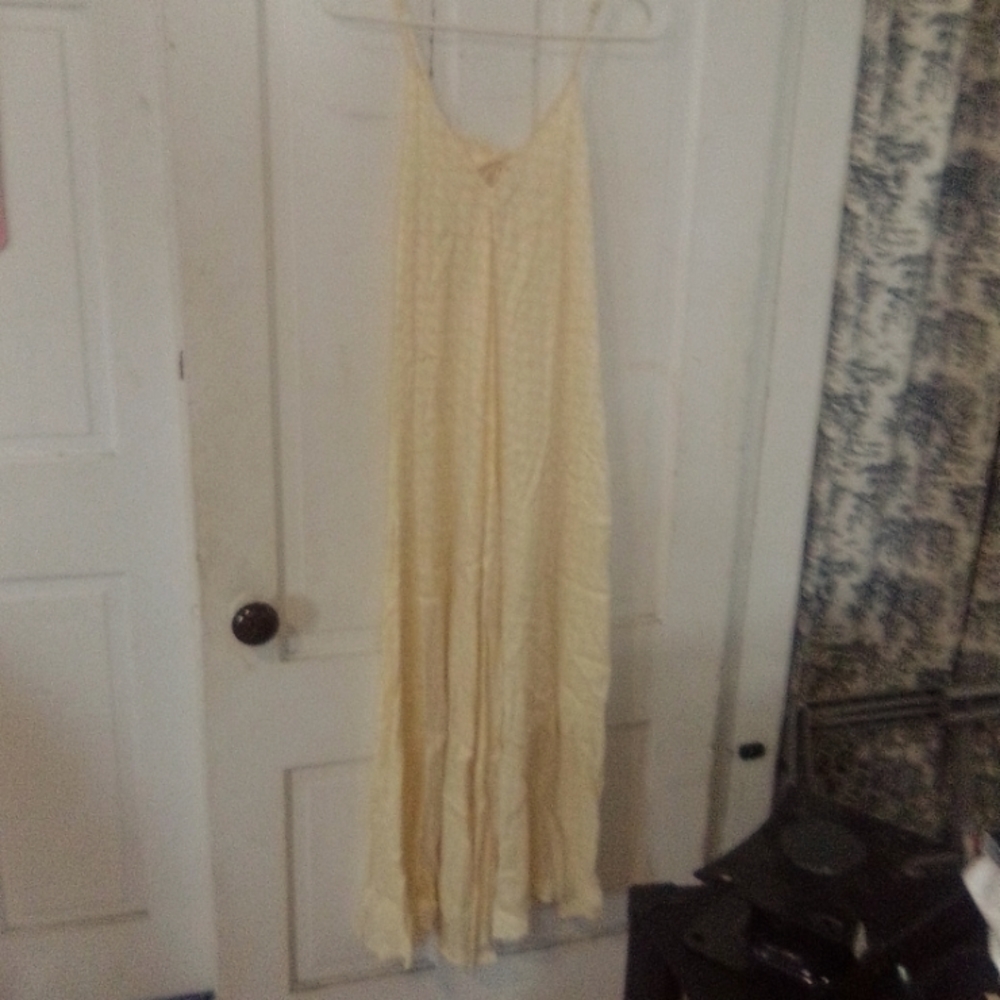 Long soft satin texture  pale yellow maxi dress with peekaboo back and bow .